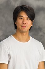 Portrait of Oliver Lin on a dark gray background