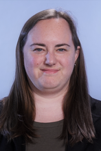 Head shot of Amanda Ramey on a blue background