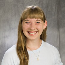 Head shot of Rachel Schaaf on a gray background