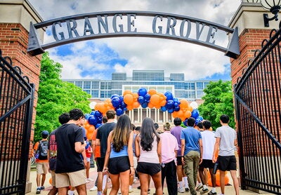 Students walking through entrance to Grange Grove