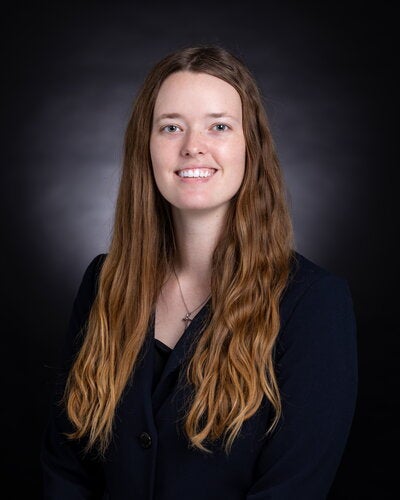 Portrait of Faith Kern on a dark background
