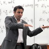 Prashant Jain teaches class standing in front of a wipe off board.
