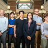 Group of six researchers stand side by side in the atrium of the Beckman Institute on the Illinois campus