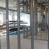 Steel frames of walls and other construction materials in a large open space under construction in Noyes Lab.