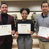 Photo of three students holding certificates