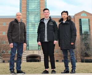 From left, Jeffrey Moore, William Neary and Yunyan Sun stand on campus with the Beckman Institute in the background.
