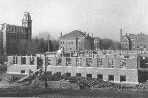 A black and white photo taken in 1901, which shows an early stage of the construction of the first couple floors of Noyes Laboratory. . 