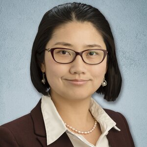 Head shot of Professor Mei Shen on a light blue background