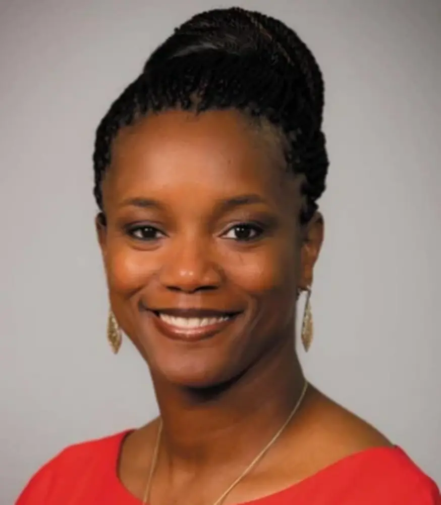 Head shot of Alveda Williams on a gray background