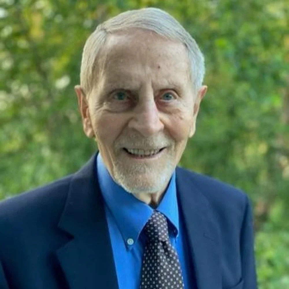 Head shot of Ted Brown in front of trees