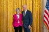 Photo of Mary-Dell Chilton standing next to President Joe Biden in front of a gold curtain with a medal around her neck in a ceremony at the White House.