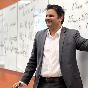 Prashant Jain teaches class standing in front of a wipe off board in a Noyes classroom.