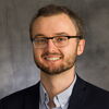 Head shot of Nick Jackson on a dark grey background