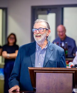 Michael Garst standing at a podium