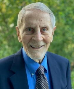 Head shot of Ted Brown in front of trees